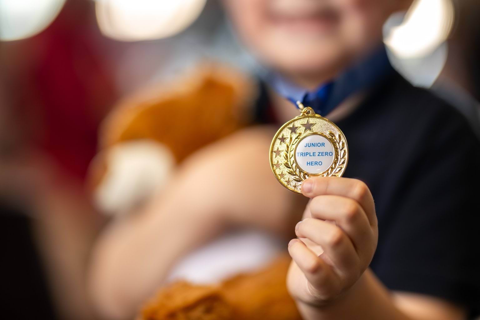 Close up picture of the Junior Triple Zero Heroes medal